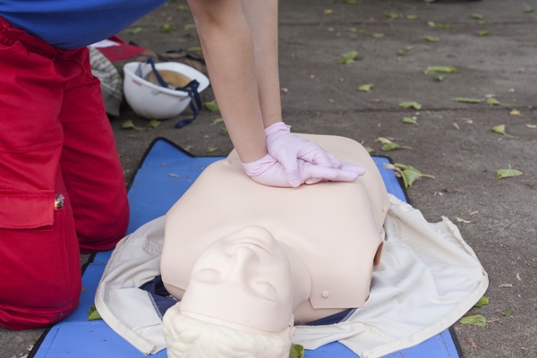 CPR being performed on a practice manikins at a American Red Cross training course in SE Wisconsin
